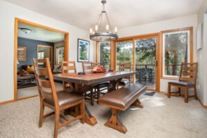 dining room with table and chairs slider doors to outdoor deck