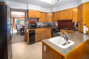 large kitchen with appliances and cabinets