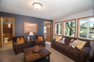 living room with brown couches and chairs