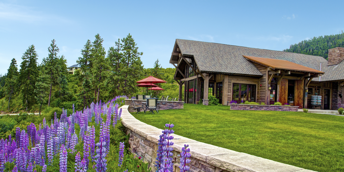 winery exterior with flowers and outdoor patio